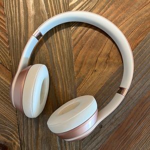Rose gold wireless headphones